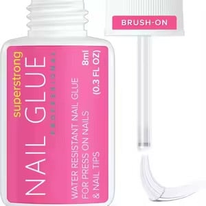 Bottle of nail glue with brush applicator for adhering press-on nails and nail tips.