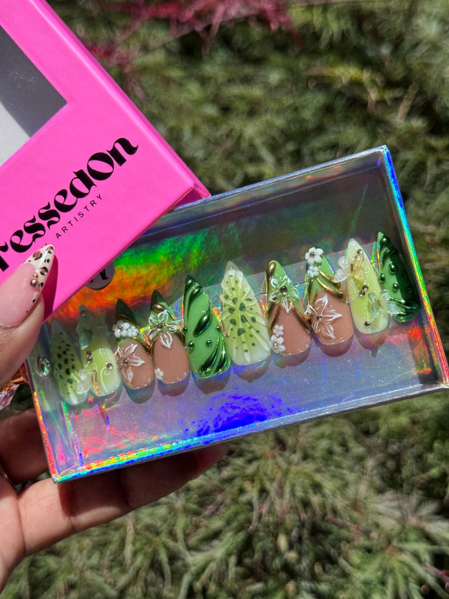 Kiwi green and brown medium-length press-on nails decorated with 3D floral accents and embellishments.