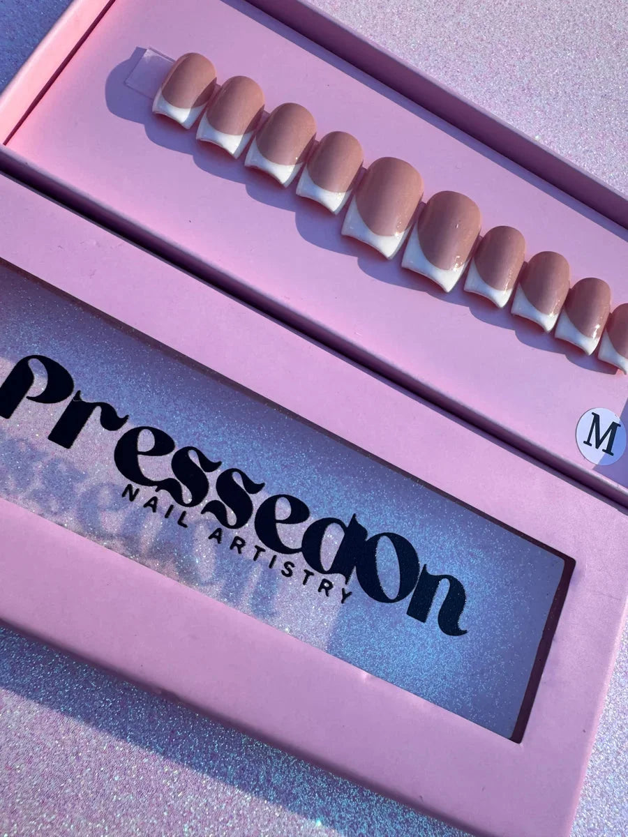 Short square press-on nails featuring a timeless white French tip design.