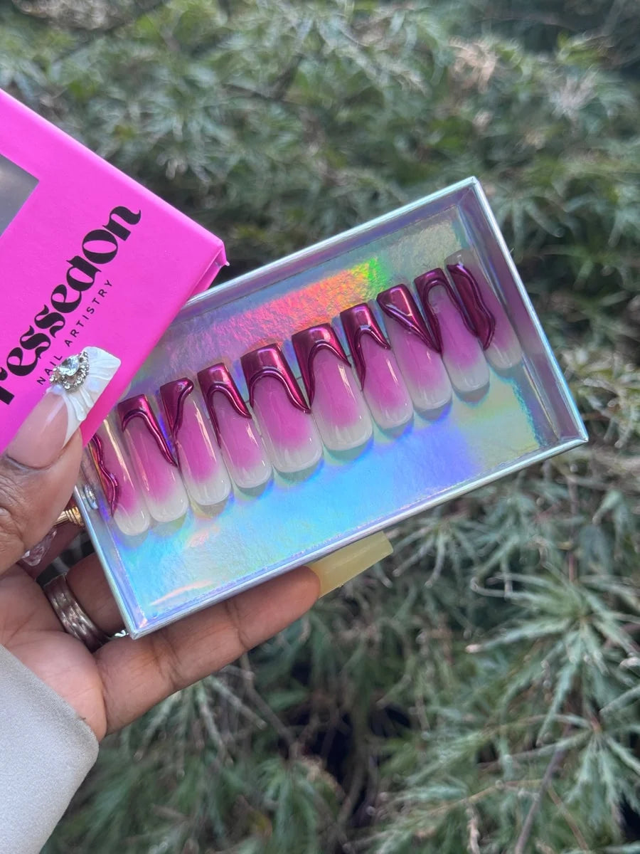 Vibrant-length press-on nails with a French tip design featuring chrome maroon accents. They fade from a pink ombre to a white base, with chrome outlining the French tip.