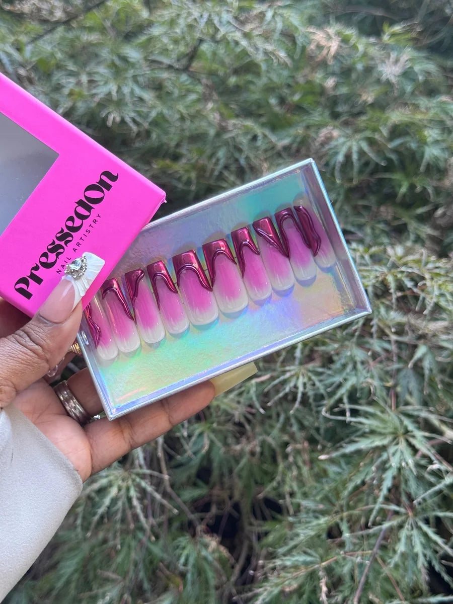 Vibrant length press-on nails feature a pink and white ombre base with a magenta chrome French tip. The design offers a modern and stylish appearance.